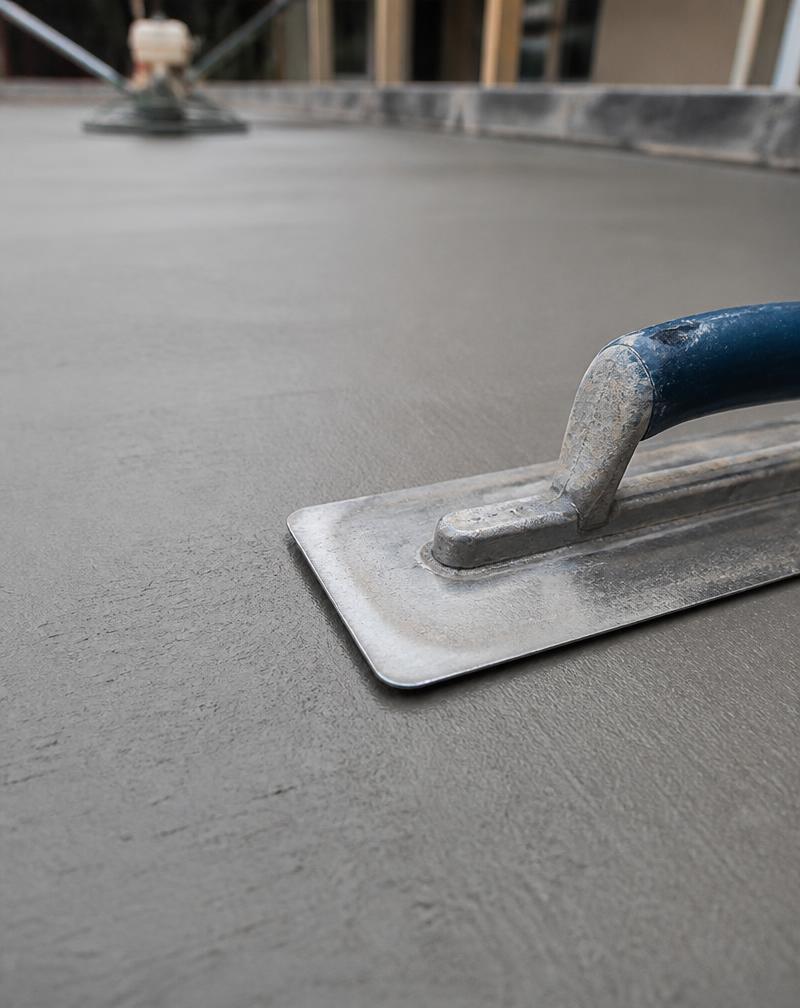 Freshly finished smooth concrete surface with professional tools